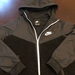 Boys Black Nike jacket nylon with fleece on lower half. Great condition.